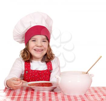 happy little girl cook eat soup