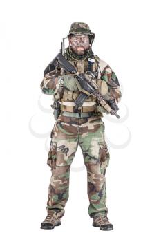 Special forces United States in Camouflage Uniforms studio shot. Holding weapons, wearing jungle hat, Shemagh scarf, painted face, his outfit clothes designed for jungle warfare. Studio shot isolated