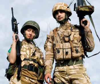 British Royal Commandos in desert uniform holding their rifles