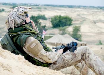 soldier in desert uniform at rest