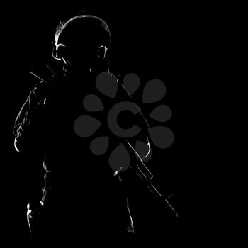 Contour shot of spec ops soldier on black background