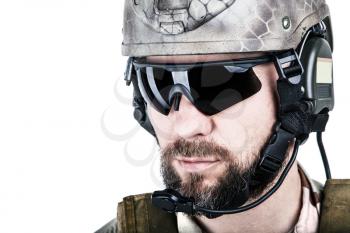 Close up image of bearded special warfare operator in protective helmet