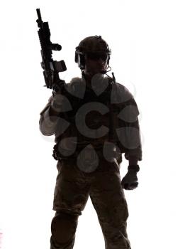 Silhouette of special warfare operator with assault rifle