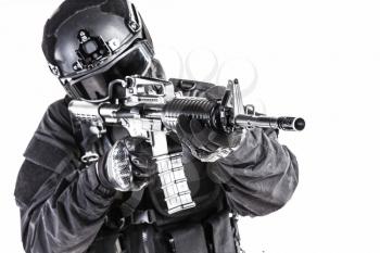 Spec ops police officer SWAT in black uniform and face mask