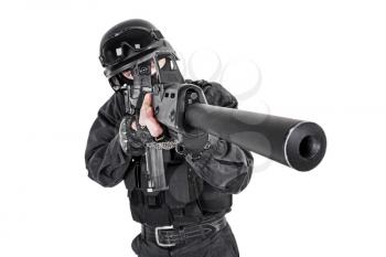 Spec ops police officer SWAT in black uniform studio shot