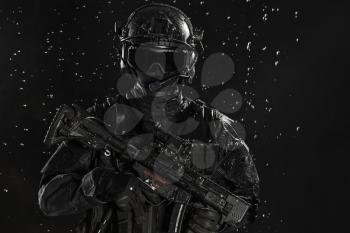 Spec ops police officer SWAT in the rain