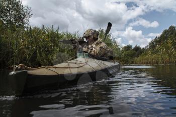 Special forces operators in the military kayak