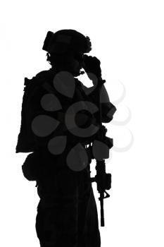 United states Marine Corps special operations command Marsoc raider with weapon. Silhouette of of Marine Special Operator white background
