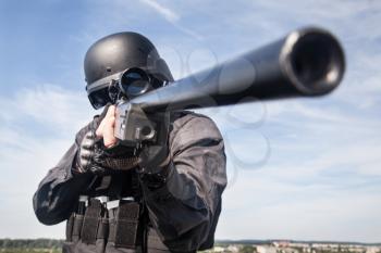 SWAT police sniper in black uniform in action