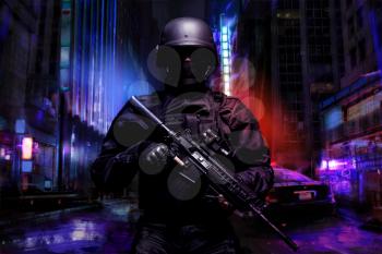 Spec ops police officer SWAT in black uniform on the street