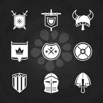 White silhouette viking knight helmets and shields icons isolated on black. Vector illustration