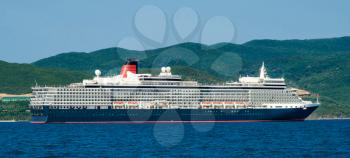 A large cruise ship enters the port