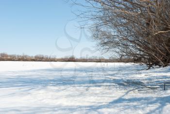 Winter landscape with frozen river