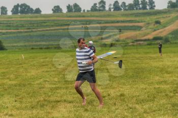 Lviv, Ukraine - July 23, 2017: Unknown aircraft modelers  launches his own radio-controlled  model  glider  in the countryside near the city of Lviv., Ukraine.