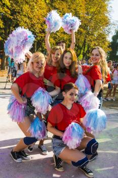 Lviv, Ukraine - August 30, 2015: Cheerleaders have fun during the festival of color in a city park in Lviv.