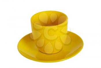 Yellow tea cup and saucer on white background.