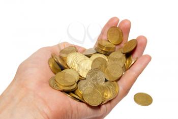 Many coins in a hand isolated on white.