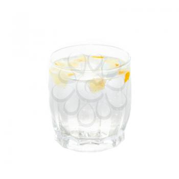 A cold water glass with lemon isolated on white.