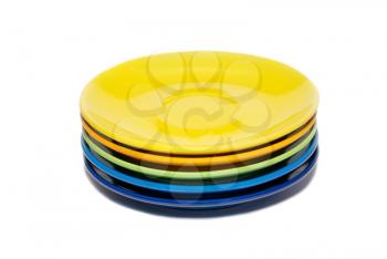 Stack of colored ceramic saucer isolated on white.