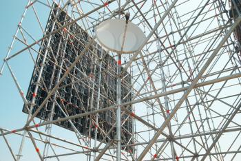 Part of the construction scaffold with satellite antenna 