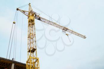 Building crane with the blue sky background
