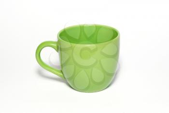 Green teacup isolated in white