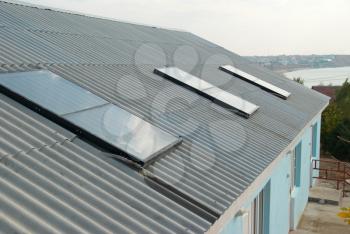 Solar water heating system on the house roof.