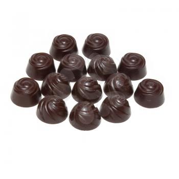 Delicious dark chocolate pralines isolated on white.