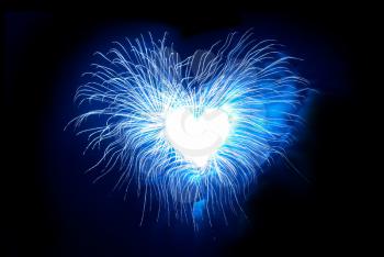Heart from fireworks on the black sky background
