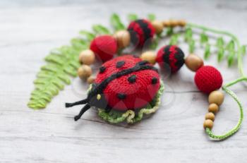 Necklace made from knitted beads and toys for the baby sitting in a sling. Knitted beads. Sling necklace.