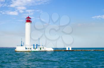 Red and white lighthouse in the sea, Odessa, Ukraine. Middle of the Black Sea.