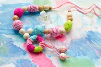 Necklace made from knitted beads for the baby sitting in a sling. Knitted beads. Sling necklace.