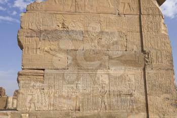 Egyptian hieroglyphs and drawings on the walls and columns. Egyptian language, The life of ancient gods and people in hieroglyphics and drawings