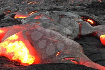 Pouring lava on the slope of the volcano. Volcanic eruption and magma