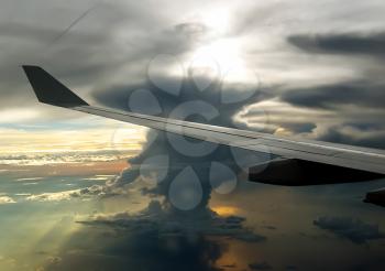 The view from the window of a passenger plane during the flight, the wing of the turbine engine of the aircraft.