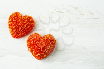 Two hearts of roses on a white wooden background, clouse up. Valentines Day background, wedding day background