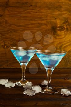 Blue Curacao liqueur cocktail in a martini glasses. Blue cocktail. Blue margarita. Blue Hawaiian cocktail. Blue curacao liqueur.  Blue Martini