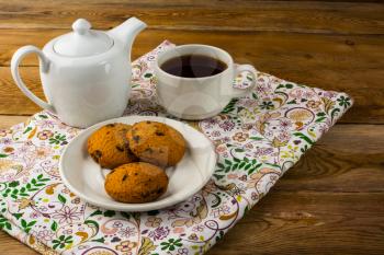 Breakfast tea on wooden background. Homemade biscuit. Homemade cookies.Sweet dessert. Breakfast cookies. Sweet pastry. Cup of tea. Tea cup. Breakfast tea. 
