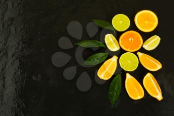 Citrus fruits on black background. Fresh food. Ripe fruit. Citrus fruit. Vegetarian food. Mixed fruit. Fresh fruit.