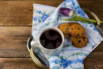 Cup of tea and cookies on serving tray. Breakfast cookies. Sweet pastry. Sweet dessert. Homemade biscuit