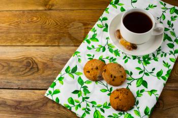 Tea cup and biscuits, top view. Breakfast cookies. Sweet pastry