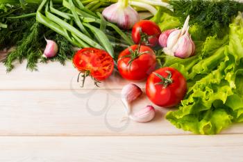 Fresh tomato and garlic, place for text. Healthy eating concept. Vegetarian food. Healthy eating. Ripe vegetables. Fresh vegetables.