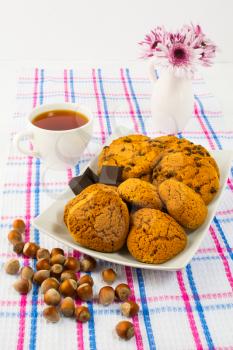 Homemade cookies, nuts  and cup of tea. Homemade cookies. Tea time. Sweet dessert. Homemade biscuit. Breakfast cookies. Tea cup