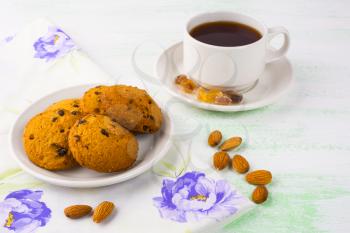 Homemade cookies,  tea cup and almond. Sweet dessert. Homemade biscuit. Breakfast cookies. Tea cup. Tea time. Homemade cookies.