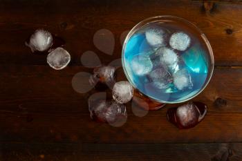 Iced blue cosmopolitan cocktail. Blue margarita. Blue cosmopolitan. Blue Lagoon. Blue cocktail. Blue Martini. Blue Hawaiian cocktail. Blue curacao liqueur.