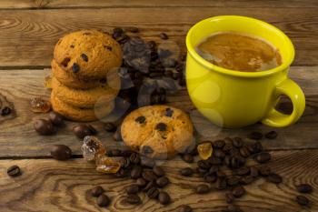 Yellow cup of coffee and cookies.  Morning coffee. Coffee cup. Coffee break