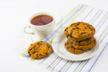 Tea time with chocolate chip cookies.  Breakfast cookies and cup of tea. 