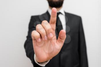Male human with beard wear formal working suit clothes raising one hand up