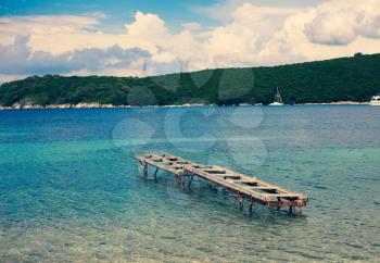 Abandoned Metal Structure Over the Surface, Remains of Fishing Dock in the Sea, Remnant of Old Pier in Cristaline Water, Tropical Harbor Landscape with Mountain Views