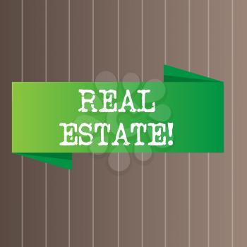 Text sign showing Real Estate. Business photo text owning property consisting of empty land or buildings Blank Folded Color Banner photo on Vertically Striped Two Toned Backdrop